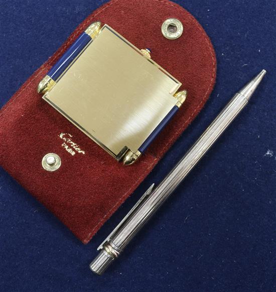 A Cartier pen and a Cartier travelling clock